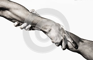 Close up help hand. Two hands, helping arm of a friend, teamwork. Rescue, helping gesture or hands. Black and white