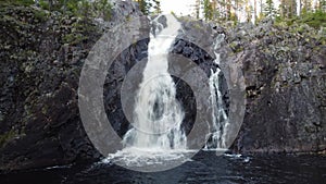 Close-up of Hepokongas waterfall in Kainuu, Finland. The flowing water from the huge rock shows the power of water and the beauty