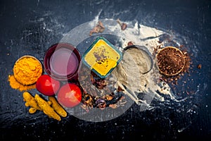 Close up of herbal face pack of tomato and turmeric with sandal wood,fuller`s earth or mulatni mitti or mulpani mitti on wooden su