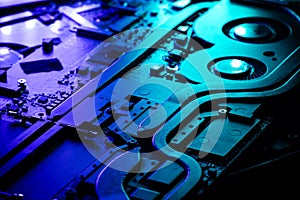 Close-up of a High-Performance GPU Cooling System with Dual Fans Under Dramatic Blue and Green Lighting