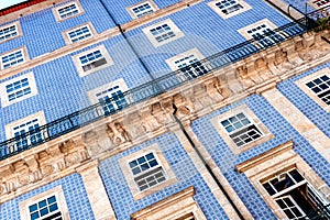 Close-up of a historic building facade in Porto`s old town with the typical blue Azulejo ceramic tiles