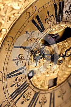 Close-up of historic gold and black clock