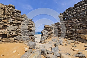 Close up historical view of Caribbean coast with ruins of gold smelter in Bushiribana.