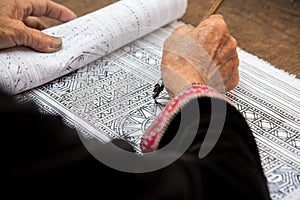 Close up Hmong hilltribe Writing candles to handmade batik in thailand