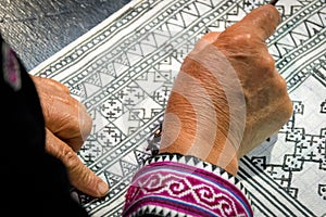 Close up Hmong hilltribe Writing candles to handmade batik in thailand