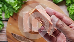 close up of holding a canned meat