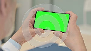 Close Up of Holding Smartphone with Green Screen