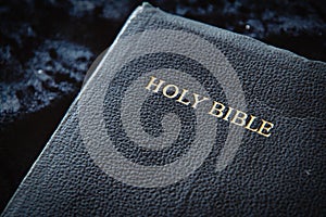 Close up of Holy Bible dark blue black leather cover