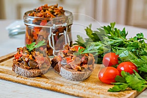 Close up home made aubergine pate or spread sandwiches and in jar