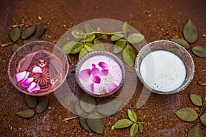 Close up of home remedy of scars or face pack to scars i.e. Sandal wood powder with milk and rose water on wooden surface with