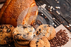 Close up of homemade bakery products on a dark rustic wooden table.