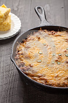 Close up of homemade chili with side of cornbread