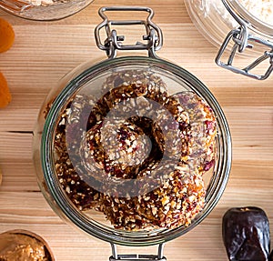 Close up homemade energy balls in glass jar