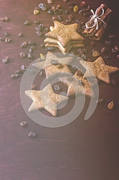 Close up of homemade ginger cookies, cinnamon with raisins on a red wooden table