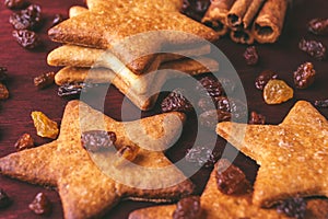 Close up of homemade ginger cookies in the shape of a star with raisins