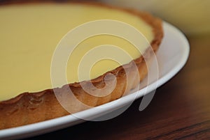 Close Up Homemade Lemon Cheesecake Pie on Dark wooden Background. Food Preparing. step by Step Dessert Cooking Process.