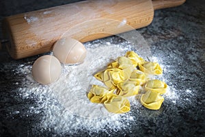 Close up of homemade raviolis made from eggs, wheat flour filled with cheese and spinach vegetable for vegan