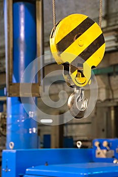 Close up hook crane of overhead crane in factory, machine part concept