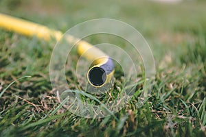 Close up of a hose pipe lying on the ground