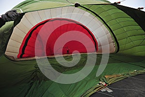 close-up of hot air balloon basket burners and red envelope photo