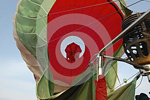 close-up of hot air balloon basket burners and red envelope photo