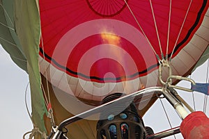 close-up of hot air balloon basket burners and red envelope photo