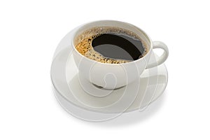 Close up of of Hot fresh black coffee with milk foam for breakfast menu in white ceramic cup with white plate isolated on white ba