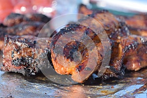 Close up of hot sticky ribs on tinfoil