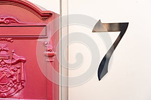 Close-up of house number and mailbox