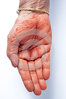 Close-up of human hand with holi powder in hand isolated on white background