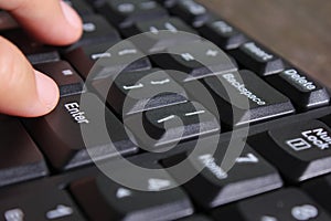 Close-up of human hands on keyboard