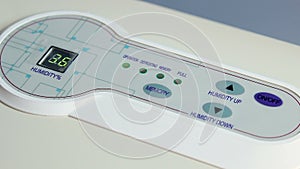 Close-up of humidity control interface, altering air moisture levels, utility