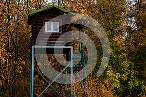 Close up of hunting tower in autumn forest