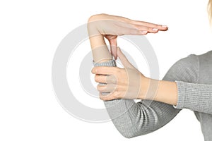 Hypermobile woman hand bending thumb isolated on white photo