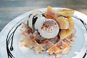 Close up of ice cream and waffle.