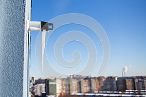 Close-up of icicle on gas boiler chimney in winter time. Flue of gas boiler in apartment