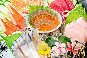 Close up ikura salmon roe in sashimi set