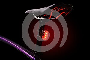 Close-up of illuminated bicycle tail light