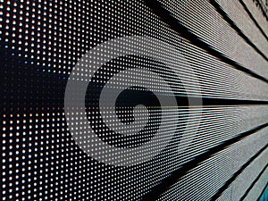 Close-up of illuminated LED display panel with grid pattern