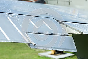 Close up image of an airfoil of an old aircraft