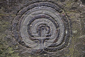 A close up image of an ancient petroglyph in a valley in Cornwall