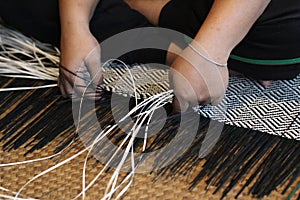 Close-up image of asian female hands tailor manual working sewing crafting at textile factory