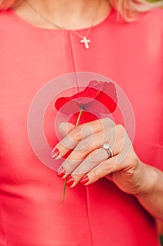 Close up image of beautiful woman`s hand with perfect red manicure