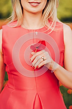 Close up image of beautiful woman`s hand with perfect red manicure