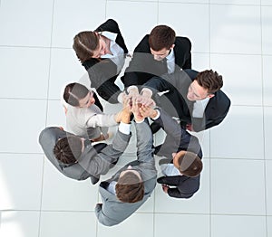 Close up image of business people making a stack of hands