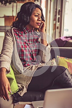 Close up image of business woman talking phone.