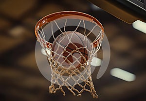 Close-up capturing the dynamic movement of a basketball through the net