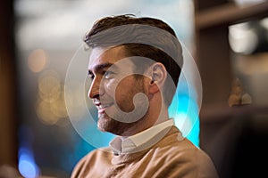 A close-up image captures a stylish man patiently waiting for his iftar meal during Ramadan, exuding an air of