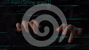 Close-Up of Hands Typing on Laptop with Code and Programming Syntax in Dark Environment, Representing Software