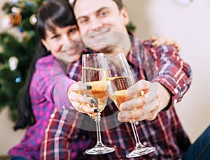 Close up image couple hands with bubble wine goblets